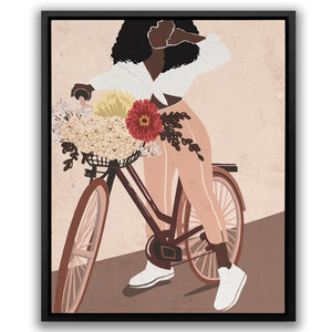 a woman riding a bike with flowers in the basket