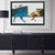 a picture of a bull on a wall above a sideboard