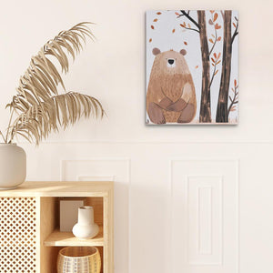 a picture of a bear on a wall next to a potted plant