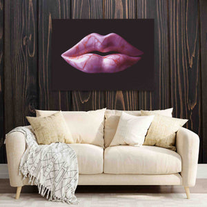 a couch with a painting of a pink lips on it