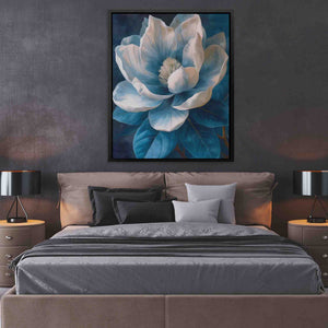 a picture of a bed with a blue flower on it