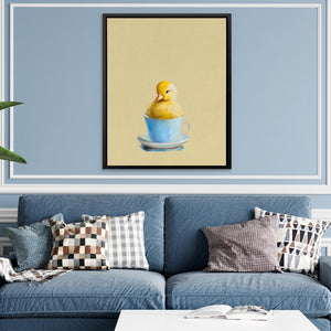 a living room with a blue couch and a painting of a ducky in a