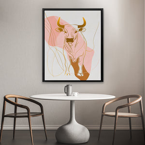 a picture of a cow on a wall above a table