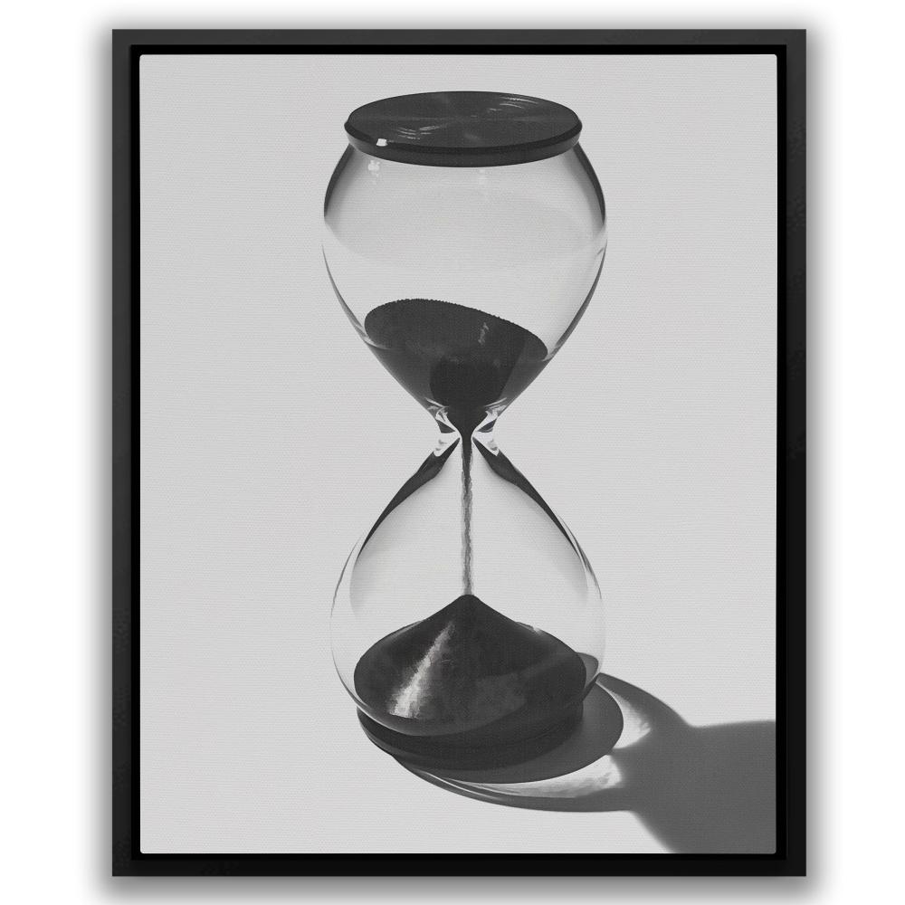 a black and white photo of an hourglass