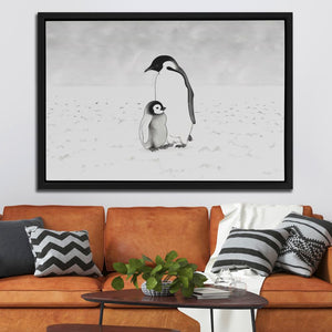 a penguin and a penguinling in the snow