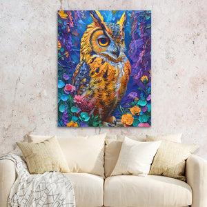 a painting of an owl on a wall above a couch