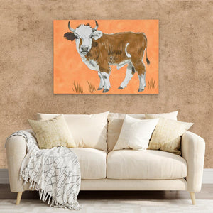 a living room with a couch and a painting of a cow