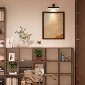 a living room with a chair and a book shelf