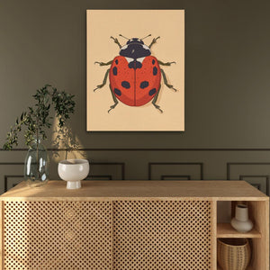 a painting of a lady bug on a wall