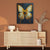 a painting of a butterfly on a brown wall