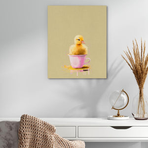 a yellow duck in a pink cup on a table