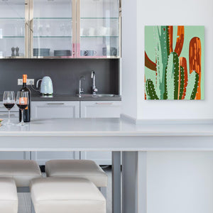 a kitchen with a white counter top and a painting on the wall