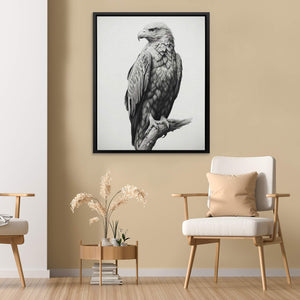 a black and white photo of an eagle sitting on a branch