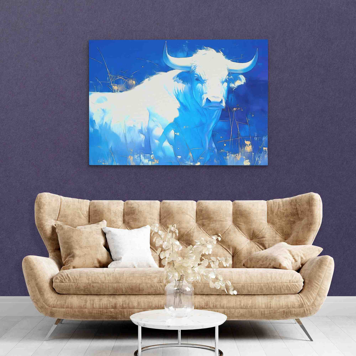 a living room with a couch and a painting on the wall