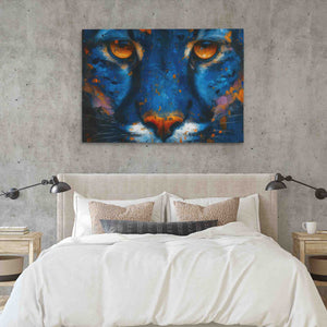 a painting of a blue tiger on a wall above a bed