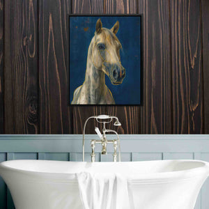 a painting of a horse hangs above a bathtub