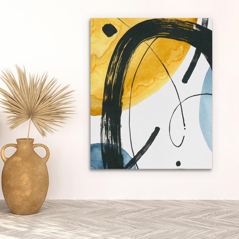 a painting on a white wall with a black and yellow design