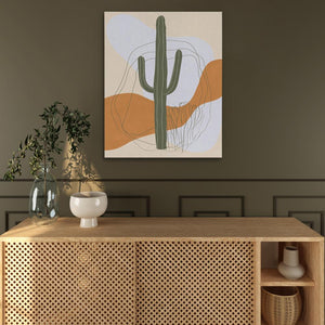 a picture of a cactus on a wall above a wooden cabinet