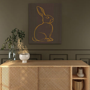 a picture of a rabbit on a wall above a cabinet