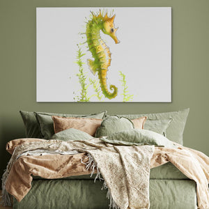 a bed with a green comforter and a painting of a sea horse