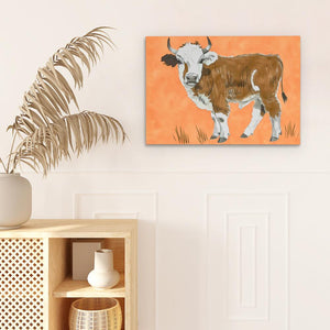 a painting of a cow on an orange background