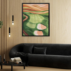 a living room with a black couch and a painting on the wall