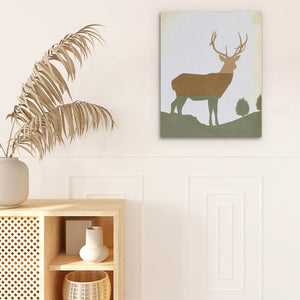 a picture of a deer on a wall next to a potted plant