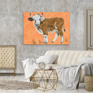 a living room with a couch and a painting of a cow