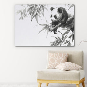 a panda bear sitting on top of a bamboo tree