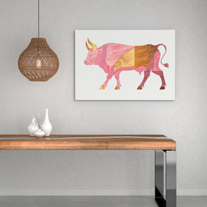 a picture of a bull on a wall above a table