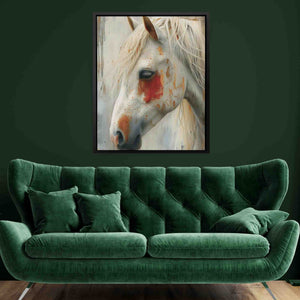 a painting of a white horse on a green wall