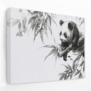 a black and white panda bear sitting on top of a bamboo tree