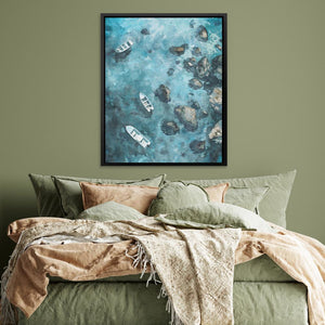 a bed with a green comforter and a painting on the wall