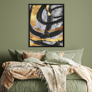 a bed with a green comforter and a painting on the wall