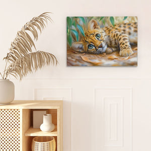 a painting of a baby leopard laying on the ground