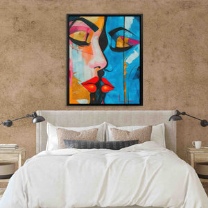 a painting of a woman's face on a wall above a bed