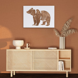 a picture of a bear on a wall above a cabinet