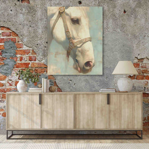 a painting of a white horse on a brick wall