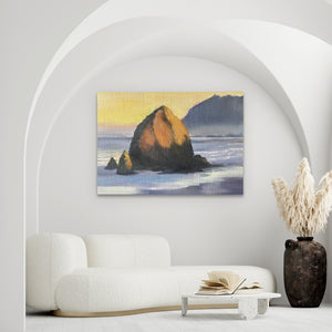 a living room with a white couch and a painting on the wall