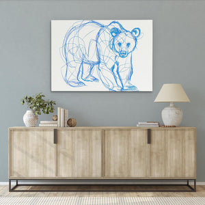 a drawing of a bear on a wall above a dresser