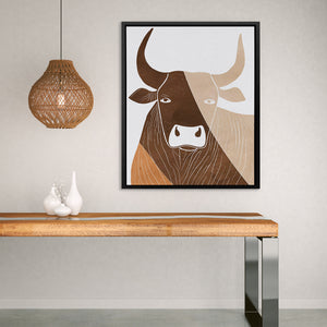 a picture of a cow on a wall above a table