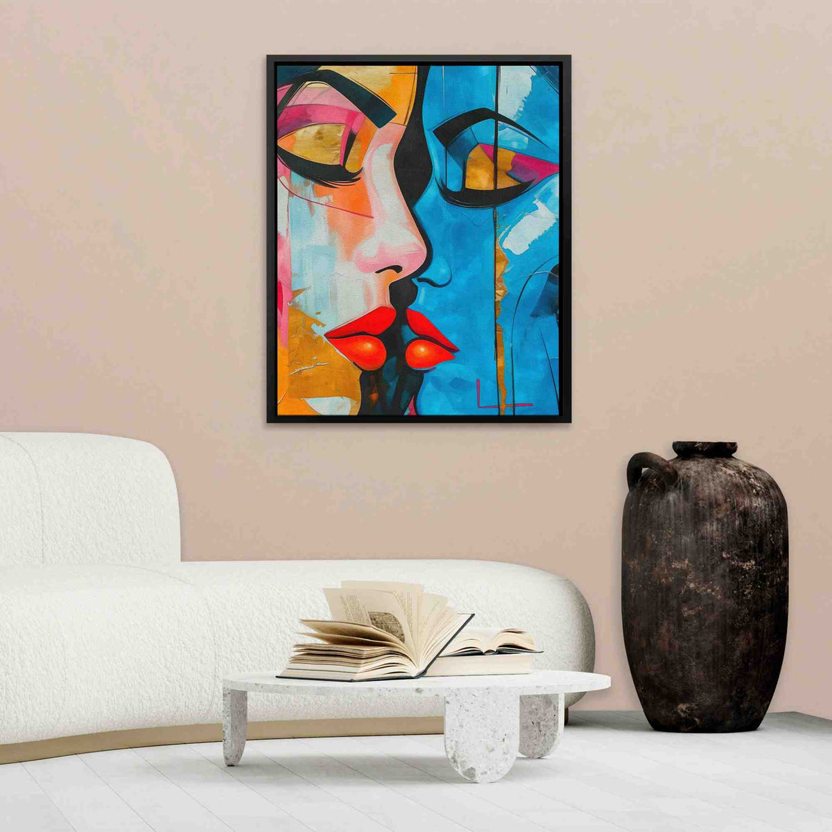 a living room with a white couch and a painting on the wall