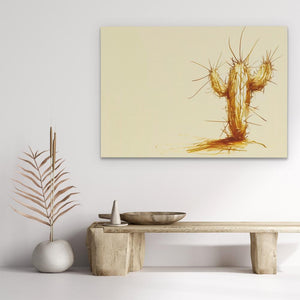 a painting of a cactus on a wall above a table