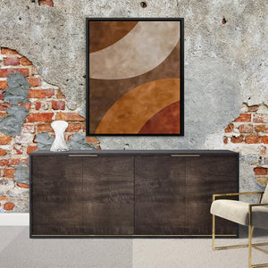 a painting hanging on a brick wall next to a sideboard