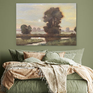 a bed with a painting on the wall above it