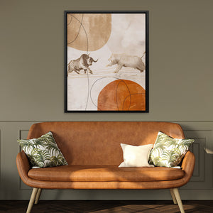 a brown leather couch sitting in a living room under a framed picture