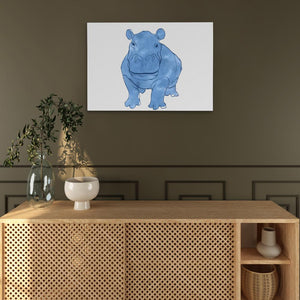 a picture of a rhinoceros on a wall above a wooden cabinet