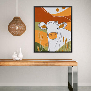 a picture of a cow on a wall above a table