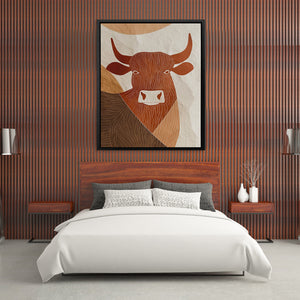 a picture of a cow on a wall above a bed