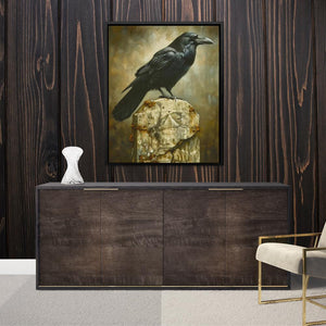 a black bird sitting on top of a wooden cabinet